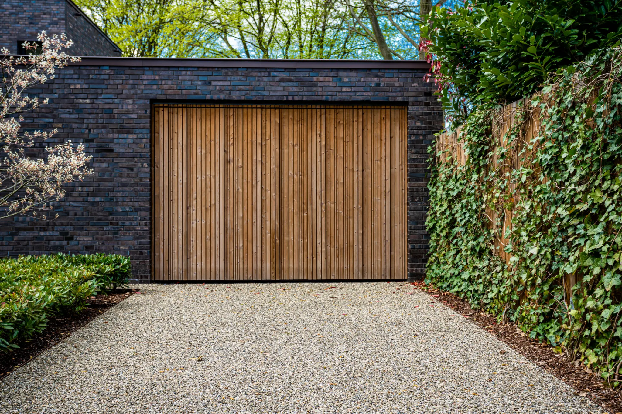 Timber garage door on luxury Melbourne home - professional installation and repair services